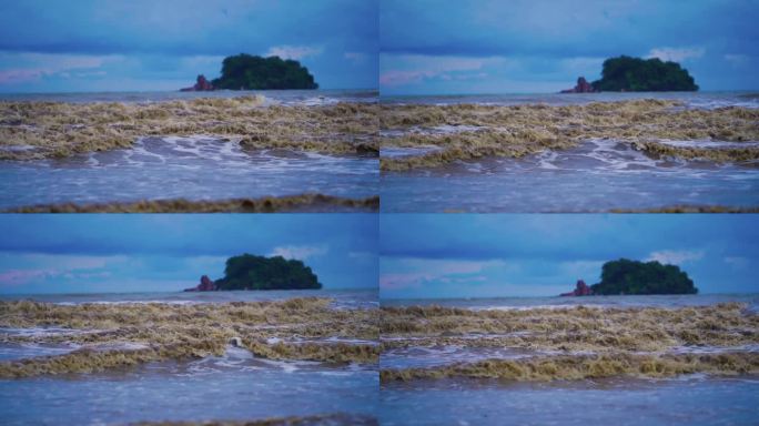 海滩上波涛汹涌，海水浑浊。