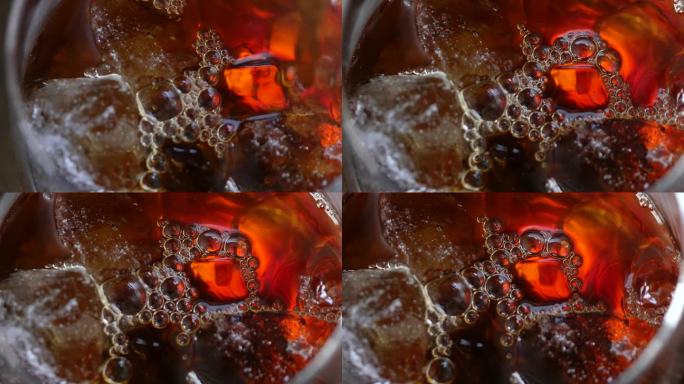 冷咖啡特写。一段将热咖啡倒入加冰的玻璃杯的视频。