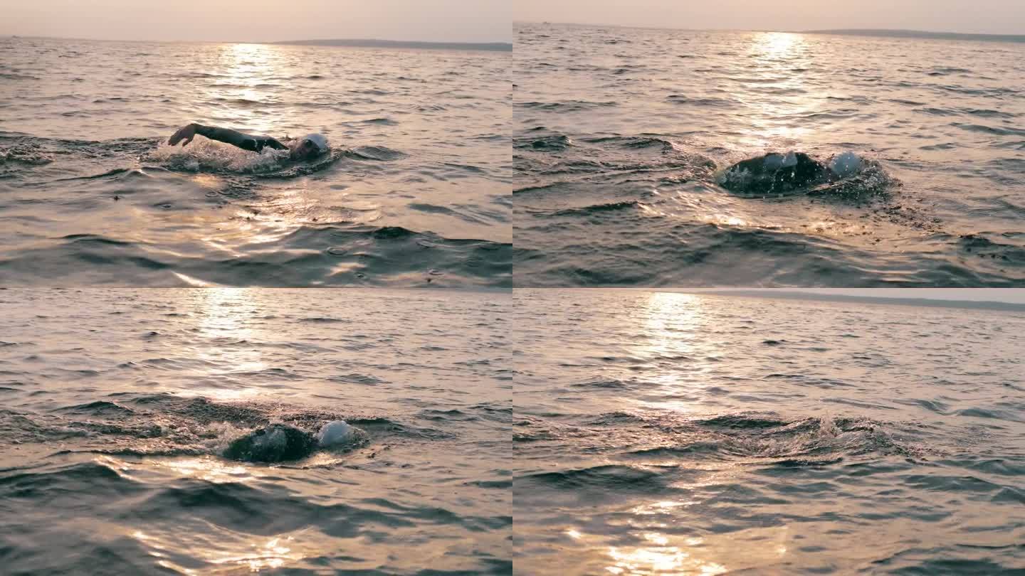 日落时分，蛙泳运动员正在横渡海洋