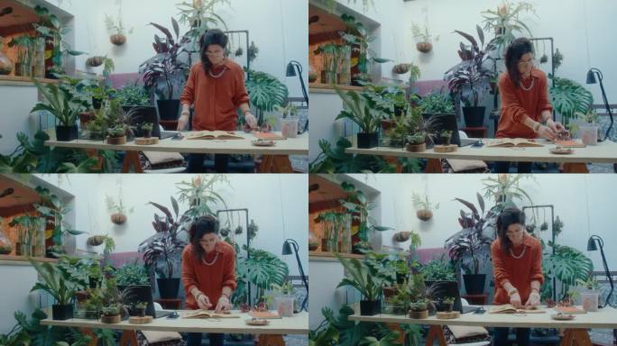 妇女在室内花园制作植物标本本