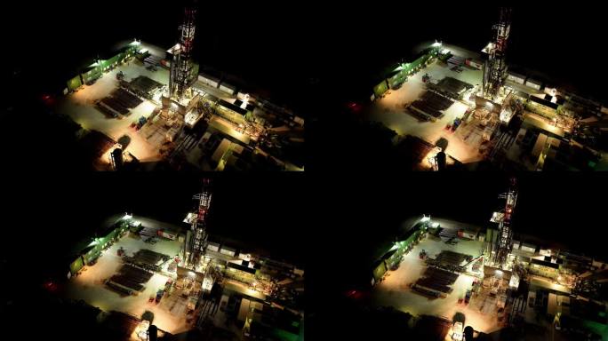 黄昏时海上自升式钻井平台的空中无人机视图。