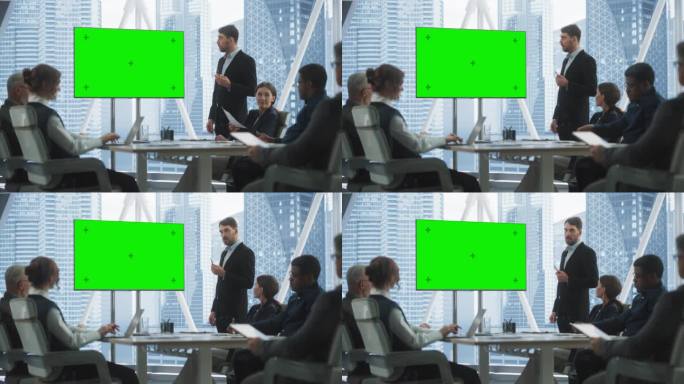 办公室会议室会议演示:高加索商人会谈，使用绿屏色度键电视机。男CEO向多民族投资者成功展示电子商务产