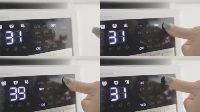 女式手转洗衣机拨盘至冷洗模式，节能理念