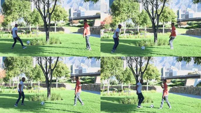 年轻人一起在城市公园里踢足球