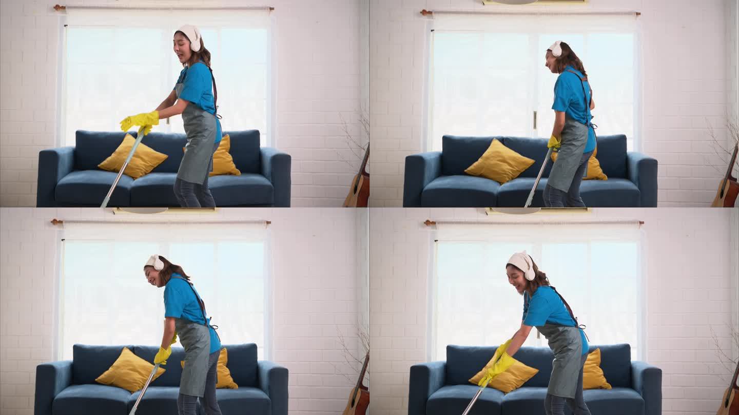 快乐的女人打扫房子和快乐跳舞，家政和清洁服务