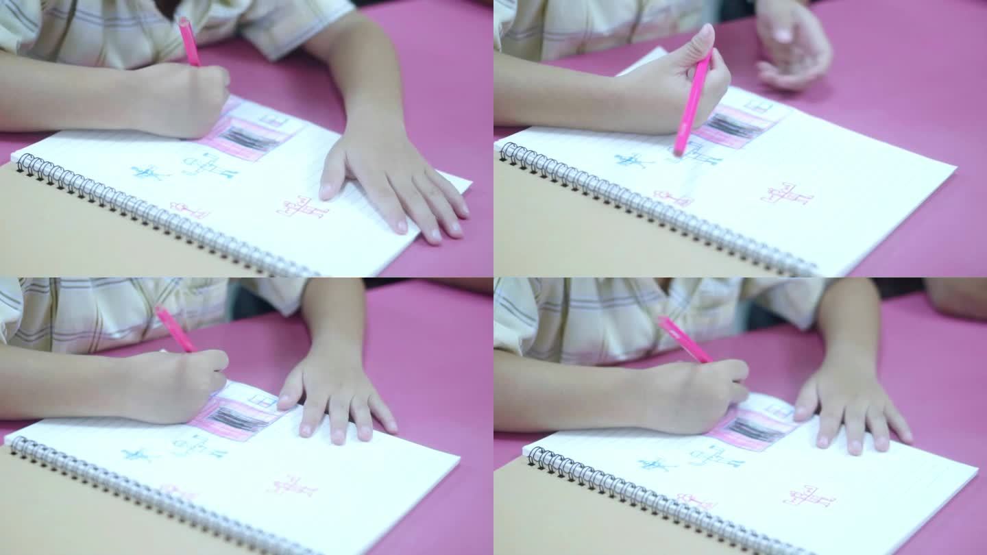 近手亚洲孩子在创意涂色书艺术工作坊在学校。