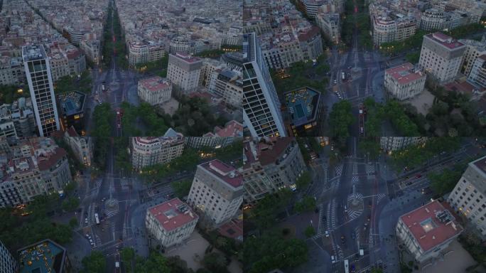 航拍的交通在道路交叉口周围高大的Obelisco de Barcelona。十字路口中央的石碑。西班