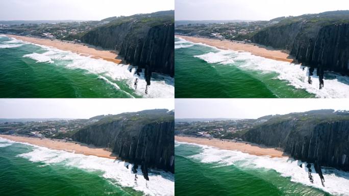 4K鸟瞰大西洋海浪和葡萄牙普拉亚格兰德海滩的岩石悬崖