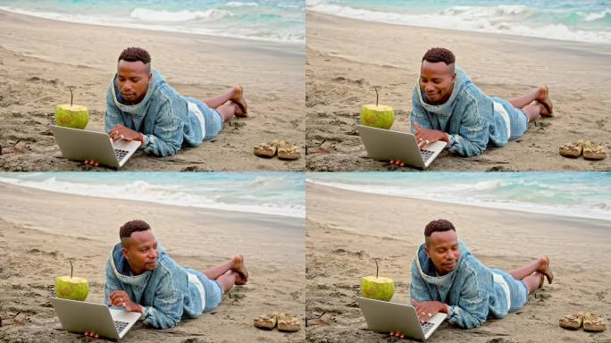 自由职业者在阳光海滩工作。非洲裔美国人类型的笔记本电脑，海边的黑人