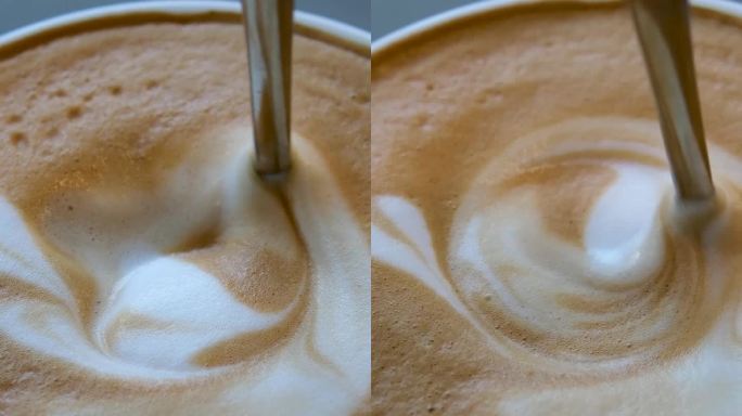 让人垂涎三尺的叶子画在美味的美式卡布奇诺咖啡泡沫上插入勺子取出滴入杯中精彩的烹饪过程展示烹饪和品尝咖