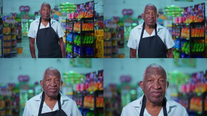 一名超市资深黑人男性员工站在超市内，系着围裙，表情中性。杂货店工作人员的非裔美国人肖像
