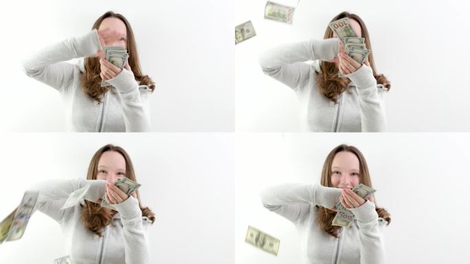 开朗的表情女孩把钱撒满房间慢动作白底钱花钞票微笑分享礼物撒财富继承