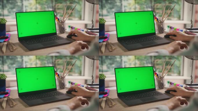 匿名设计师在笔记本电脑上工作，模拟绿色屏幕Chromakey显示与运动跟踪占位符。用于艺术内容创作和