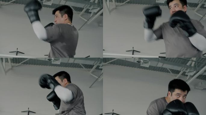 亚洲职业拳击手独自训练的肖像，阴影集中在健身房的锻炼