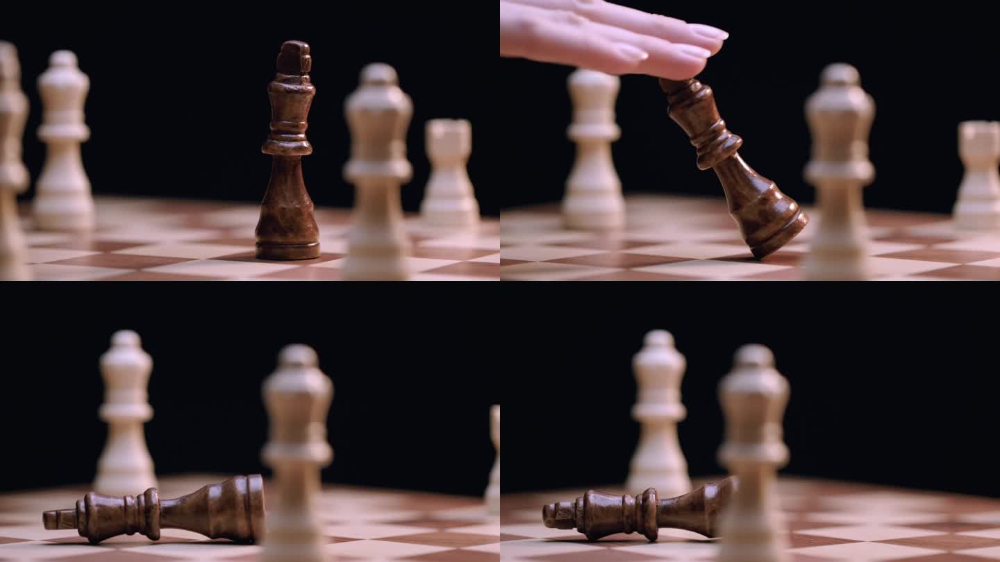 在旋转的棋盘上，高加索女人的手打翻了国王的棋子，特写镜头