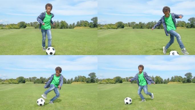 学龄非洲裔美国男孩足球运动员表演运球和假动作