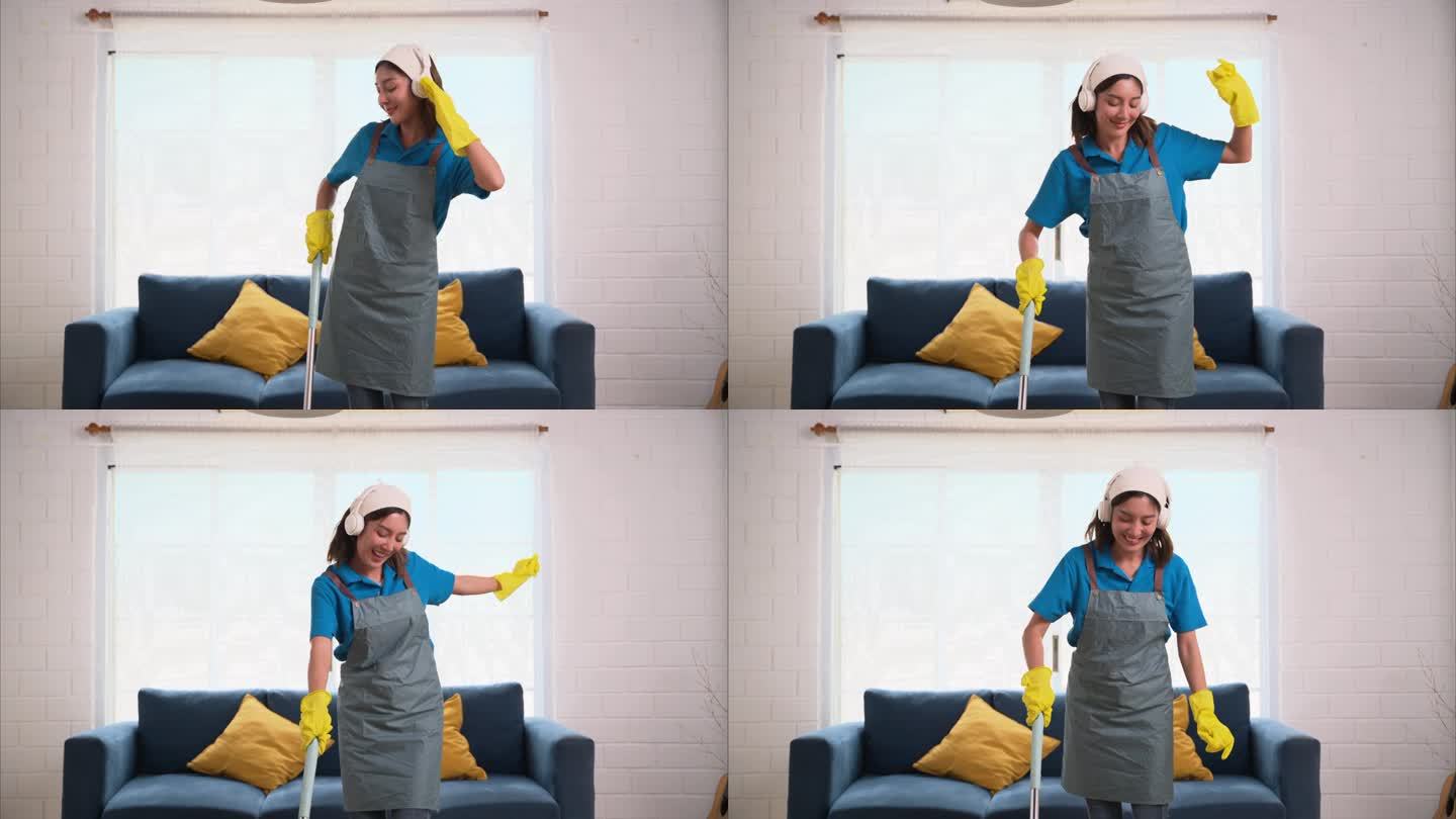 快乐的女人打扫房子和快乐跳舞，家政和清洁服务