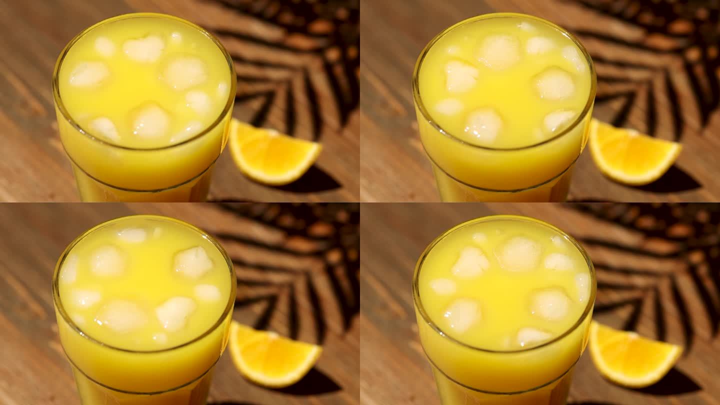 冰在橙汁里打旋。特写镜头
