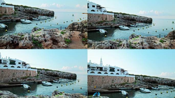 比尼贝卡湾(Binibeca well)海边的船只，背景是4K的城镇景色。