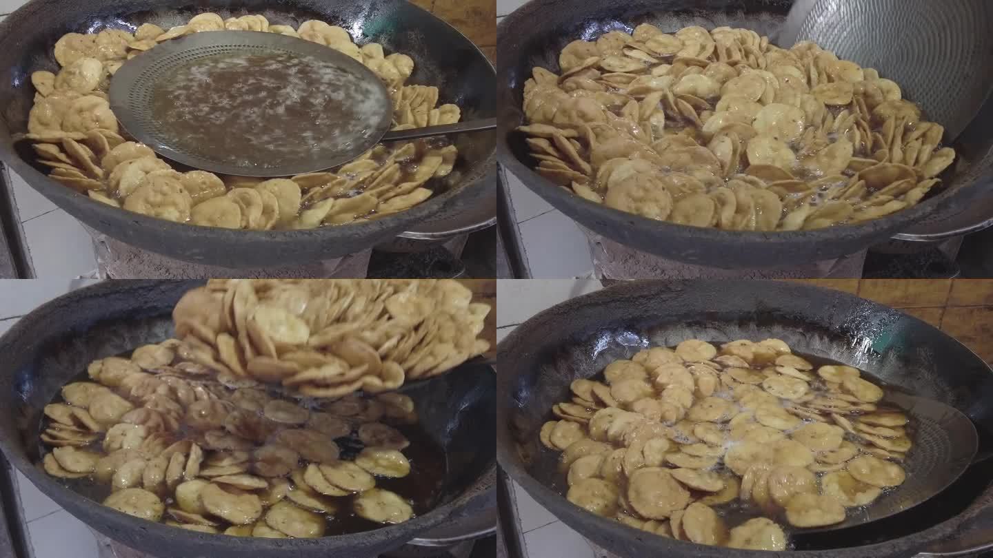 在德里的一家路边餐馆里，人们正在准备一种受欢迎的印度油炸小吃kachoris
