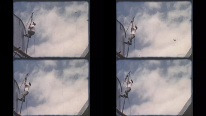 1950年代的家庭电影剪辑的建筑工人爬杆子