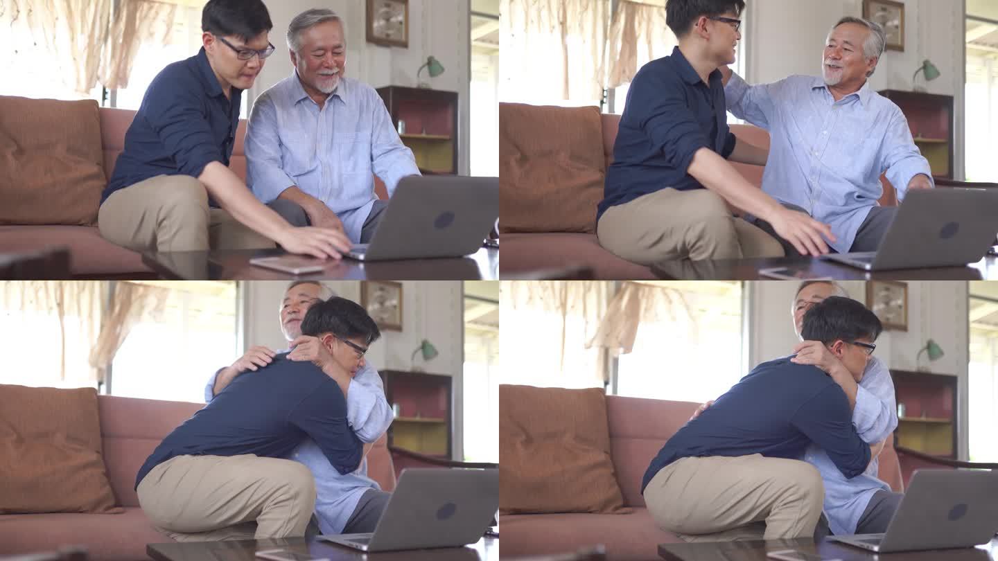 年迈的父亲和年幼的儿子在家里使用笔记本电脑