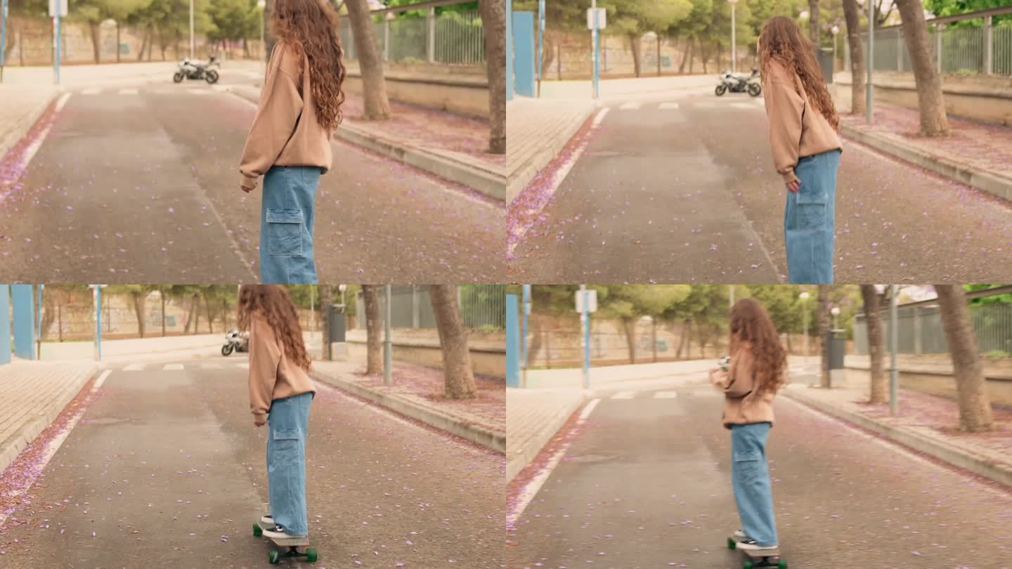 一名年轻女子在街上滑着滑板