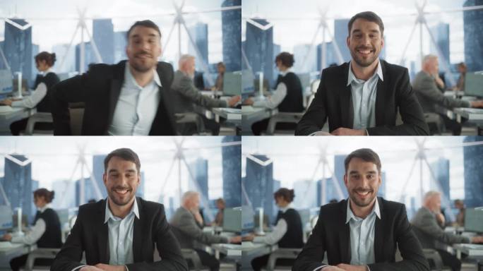从镜头的角度来看，英俊的企业家坐在他的工作场所在多样化的摩天大楼办公室。开心的白人商人看着镜头，微笑