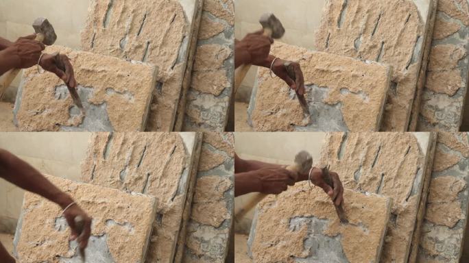 装修地砖。艺术家凿出大理石瓷砖，重新装修地板。建筑工人正在做艰苦的工作。