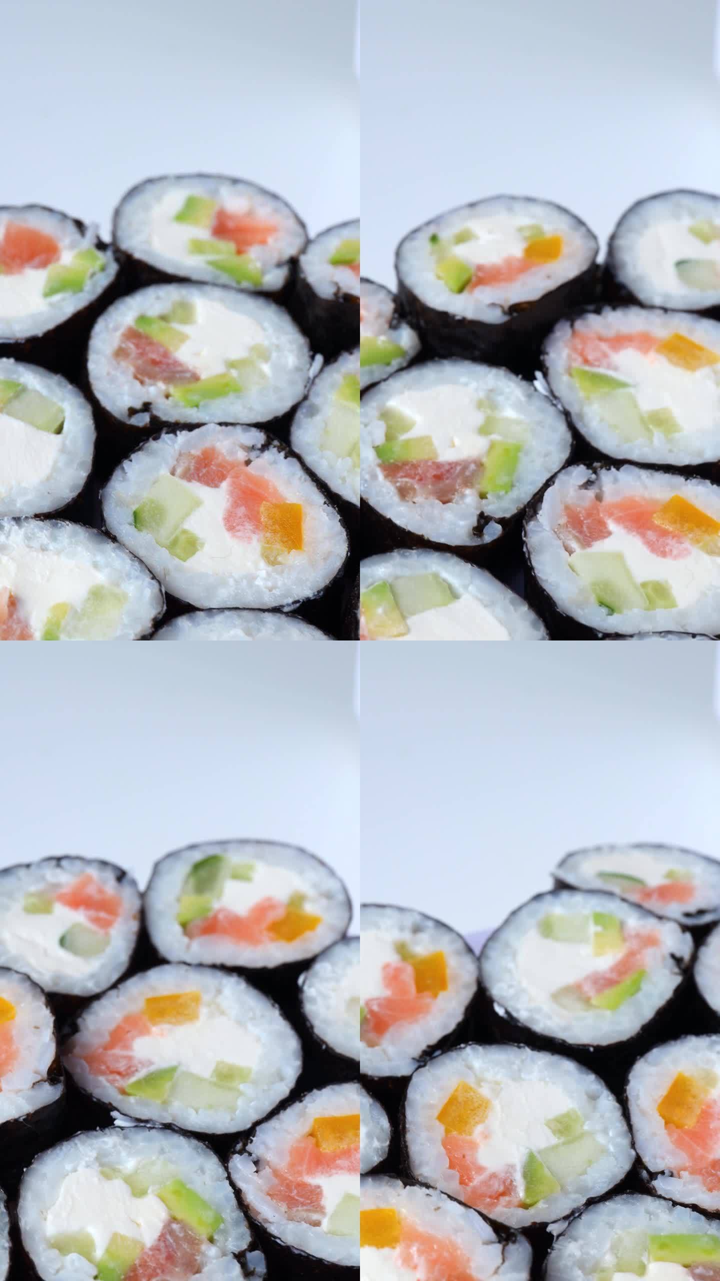 新鲜的寿司卷，绕圈旋转。自制寿司。有选择性的重点。