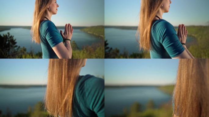 夏天，一位妇女在河上的高山上独自练习瑜伽，合十。穿蓝色工装裤的女孩。宗教，纯洁，顺从，灵性概念。