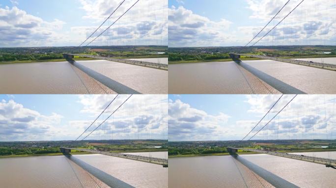 观看亨伯桥，世界上第12大单跨悬索桥，在空中无人机的视频。它横跨亨伯河，连接林肯郡和亨伯赛德郡的交通