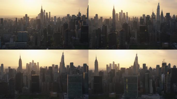 美丽的电影空中日落镜头纽约市摩天大楼和繁忙的城市街道与汽车交通。曼哈顿下城办公大楼的全景直升机视图
