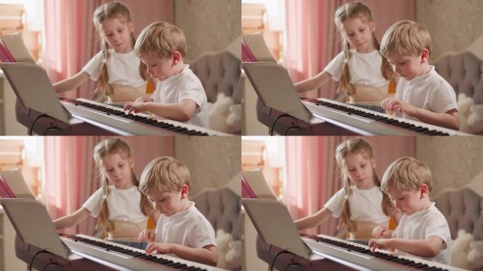 勤奋的男孩在数码钢琴上弹奏着简单幼稚的旋律
