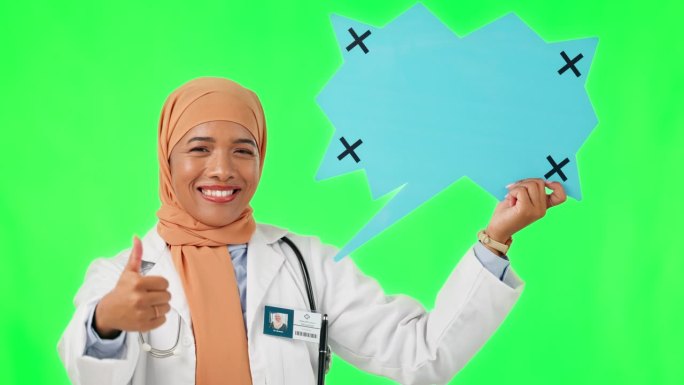 穆斯林妇女，医生，在工作室背景下成功的绿色屏幕上竖起大拇指。女性医疗保健专家指着图标的画像，比如表情