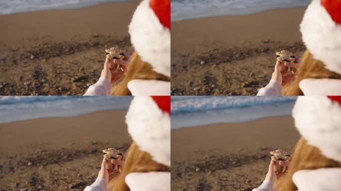 一个戴着圣诞老人帽子的女人在海边迎着圣诞节的日出，手里拿着一杯茶和姜饼干，画出一个男人的样子。