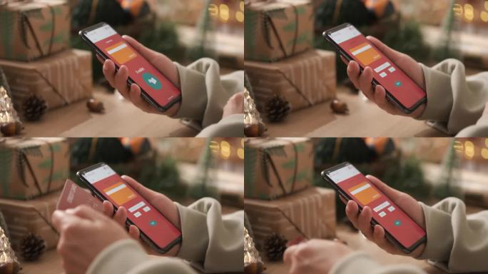 近距离拍摄女子手用手机在节日喜庆中网购圣诞礼物