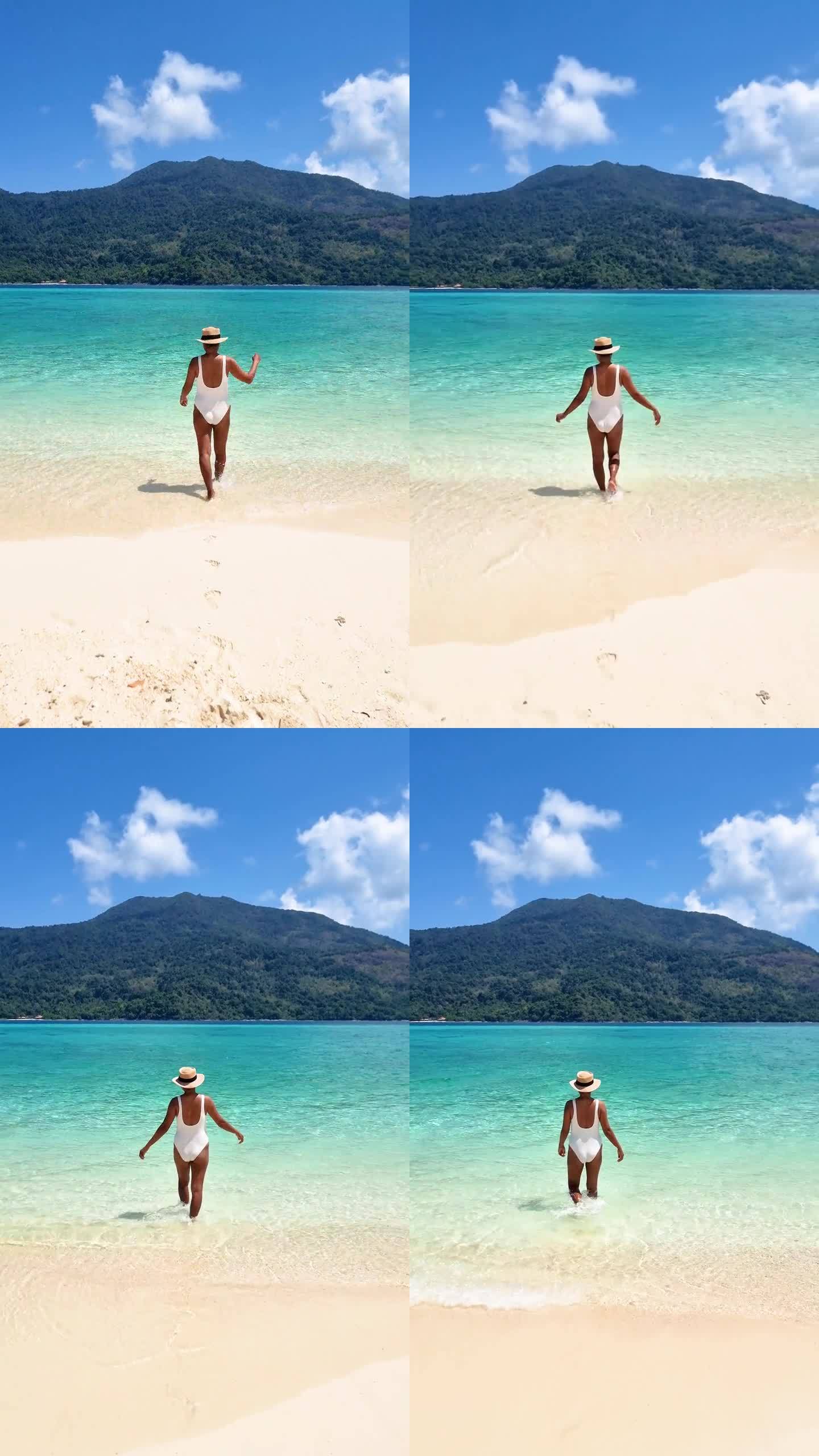 一对情侣在泰国利佩岛海滩上，这是一个有着蓝色海洋的热带岛屿