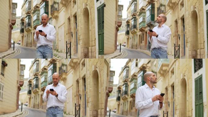 在马耳他的Cospicua，年轻的男游客正在用智能手机查找路线