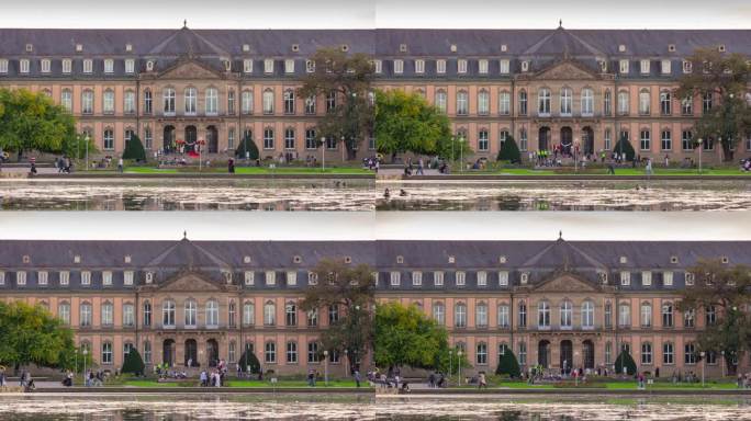 日落天空斯图加特市中心著名的宫殿池塘拥挤的广场全景4k延时拍摄德国