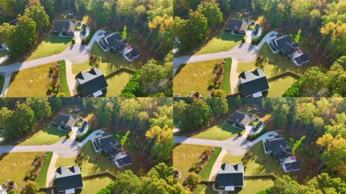 在南卡罗来纳郊区，从高处俯瞰黄色秋天树木之间昂贵的住宅。美国梦之家是美国郊区房地产开发的典范