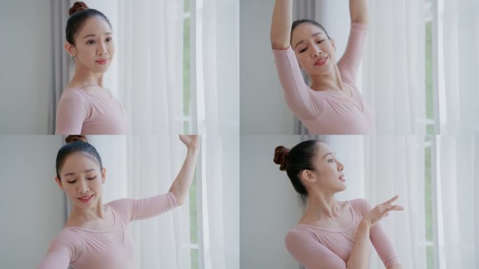 一名身着粉色芭蕾舞裙的优雅女子在舞蹈工作室里举手舞姿，年轻的亚洲女芭蕾舞演员在表演艺术活动中练习芭蕾