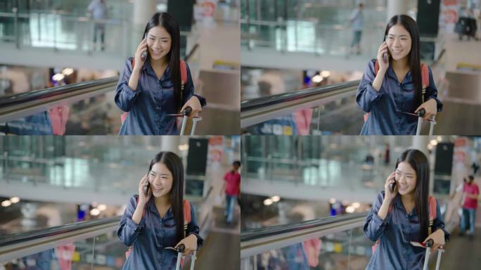 年轻的亚洲女子与朋友或家人打电话，然后开车上自动扶梯前往机场航站楼。商务、教育、通讯、生活方式、科技