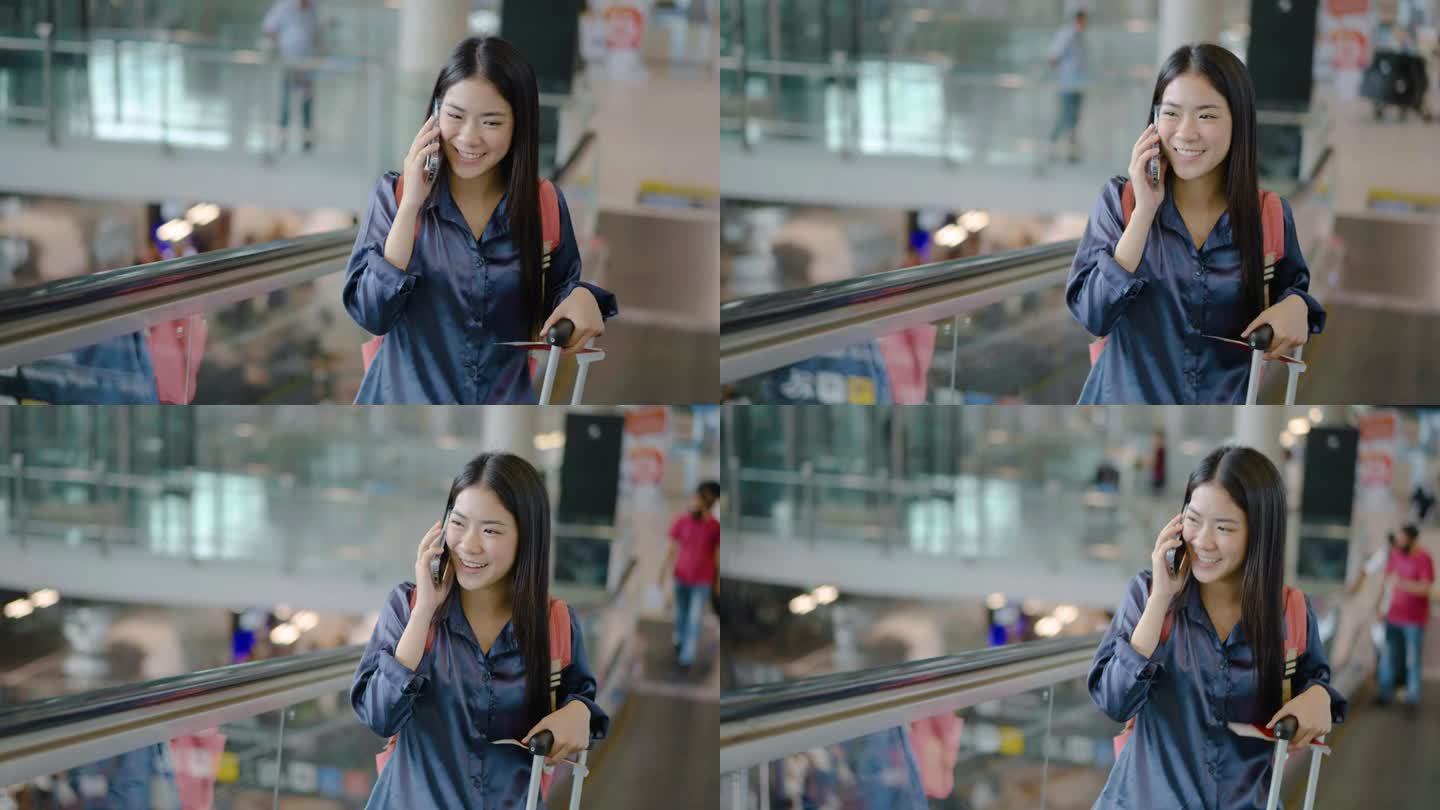 年轻的亚洲女子与朋友或家人打电话，然后开车上自动扶梯前往机场航站楼。商务、教育、通讯、生活方式、科技