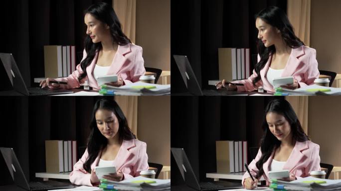 亚洲商业女性使用电脑，晚上在家工作，时间观念较长。