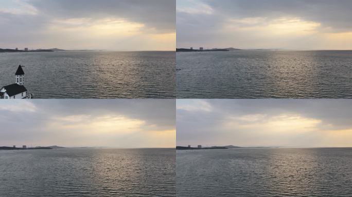 航拍威海西海岸小石岛的海上落日余晖