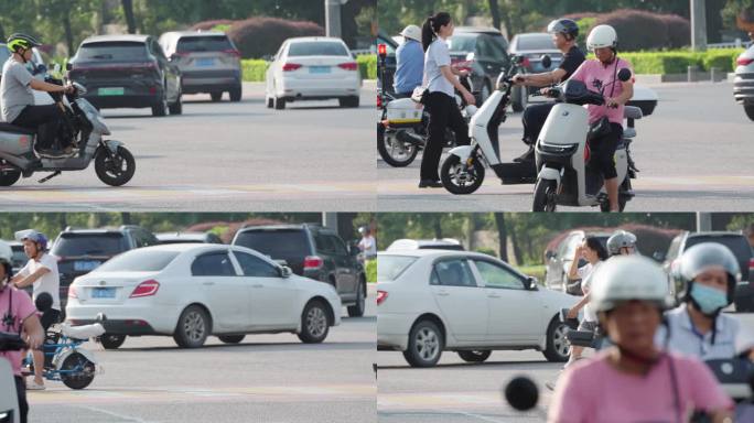 城市车流人流骑电动车的人