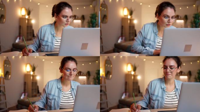 现代年轻女性在家里学习，同时使用笔记本电脑