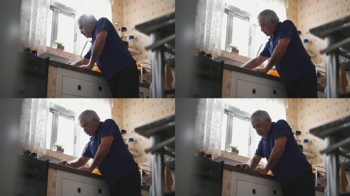 体弱多病、情绪低落的老人在厨房水槽旁的家中感到身体不适。与年老和精神疾病作斗争的老年人