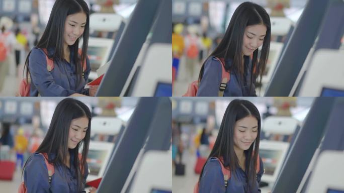 快乐旅行的年轻美丽的亚洲女人肖像，护照和机票，在机场候机楼的柜台办理登机手续，女性旅游旅客感到快乐和